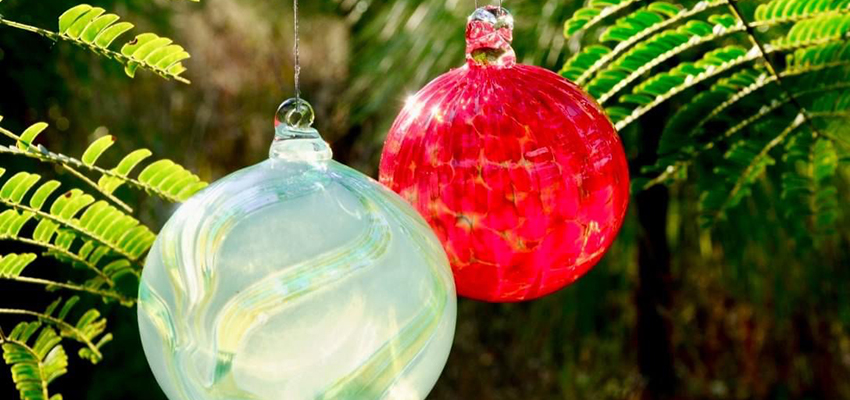 Glass ornaments hanging on tree. data-lightbox='featured'