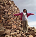 Female student standing in ruins