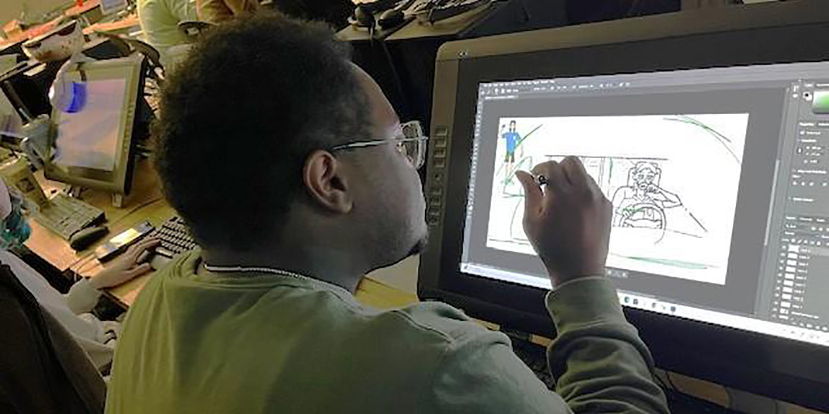 Person drawing on screen.