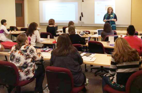 Professor teaching in front of classroom