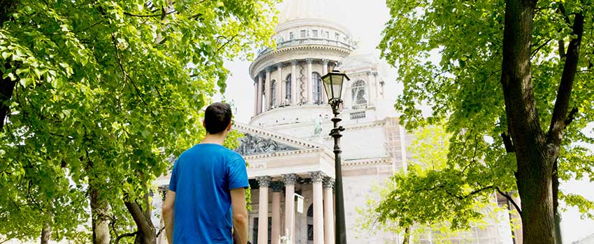 Student looking at a government building in Russia.