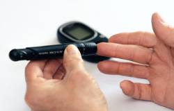 A person checks their blood sugar levels. 