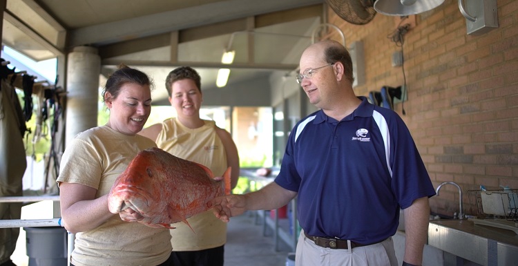 Dr. Sean Powers, right, chair of marine sciences at the University of South Alabama, is part of a $12 million independent study that includes 21 scientists from 12 institutions who will seek to determine how many red snapper live in the Gulf of Mexico.