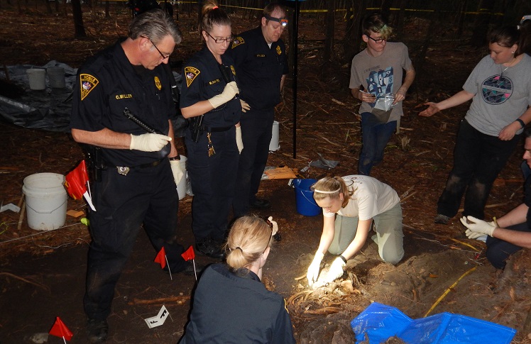 Students looking at artifacts.