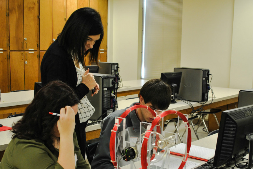 Mrs. Novovic explaining the e/m experiment