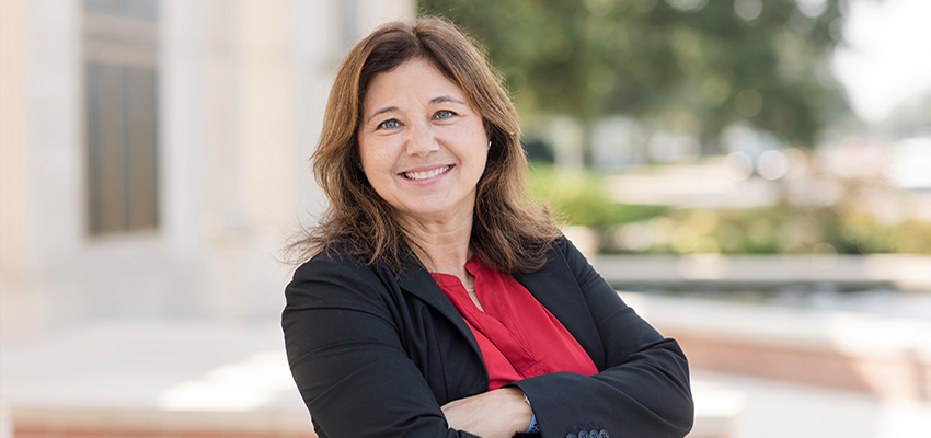 Dr. Amy Upton standing outside on campus.