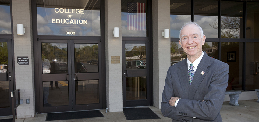 Dr. Thomas Chilton standing in front of the College of Education nd Professional Studies. data-lightbox='featured'