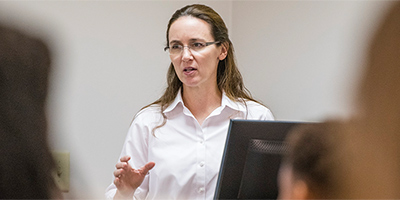 Dr. Forrester teaching in class.