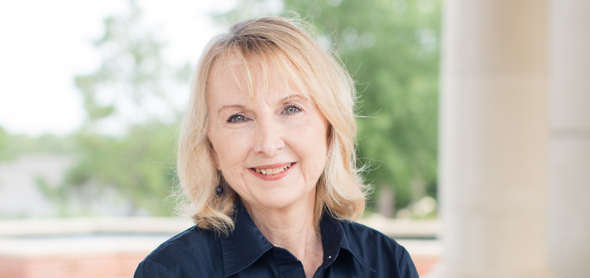 Kathy Beck outside in front of Moulton Tower.