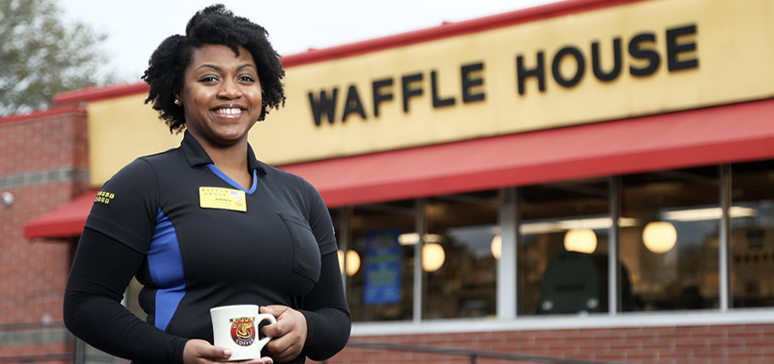 Andrea Kemp in front of Waffle House.