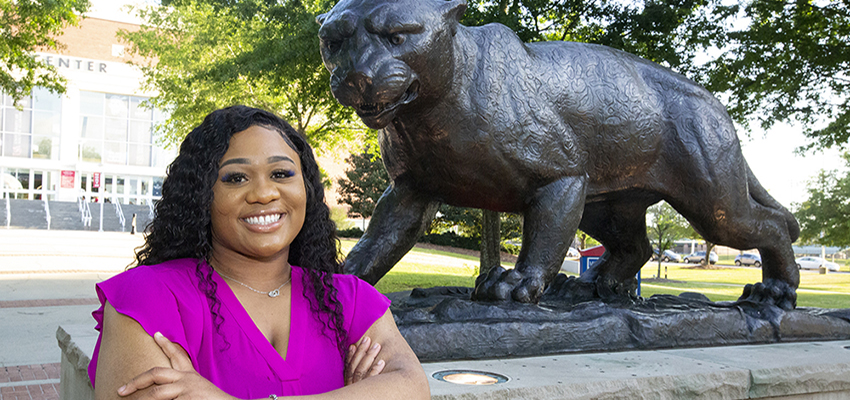 Kennedy Reese standing outside on campus.