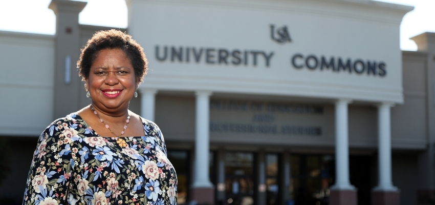 Dr. Pamela Moore standing outside of CEPS. data-lightbox='featured'