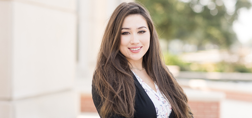 Victoria Dixon standing outside on campus.