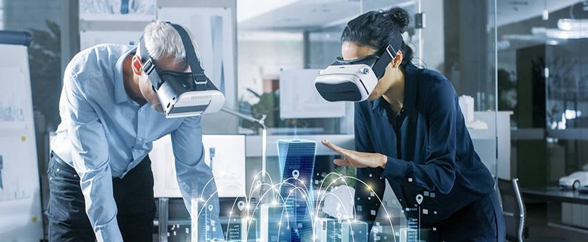 Male and female using Virtual reality glasses in a lab.