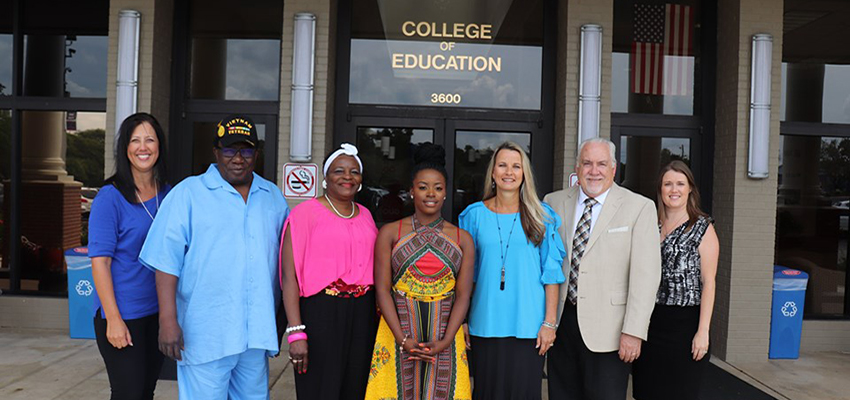 Whitfield, family, and faculty