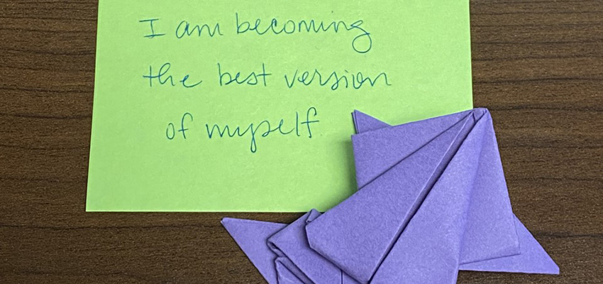 During a recent wellness session, medical students were invited to write a list of affirmations. They also created origami jumping frogs out of colored paper.