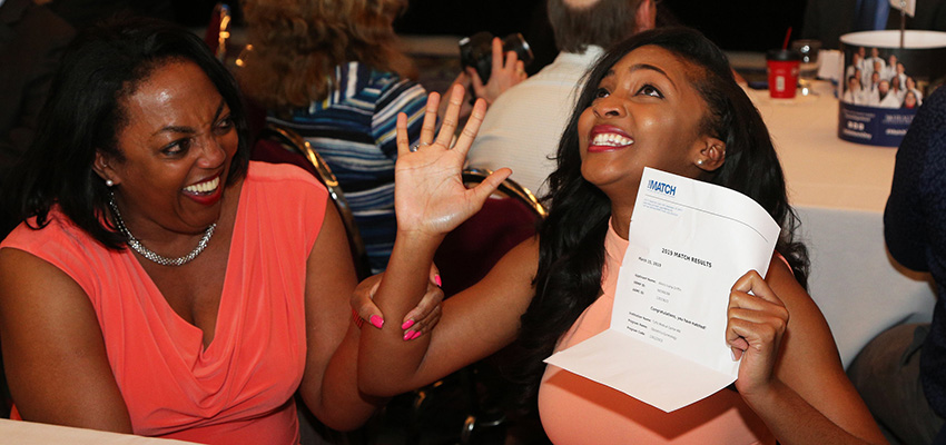 A medical student celebrates after receiving her match data-lightbox='featured'