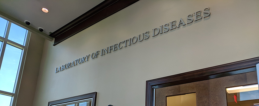 Image of door with Laboratory of Infectious Disease above it.