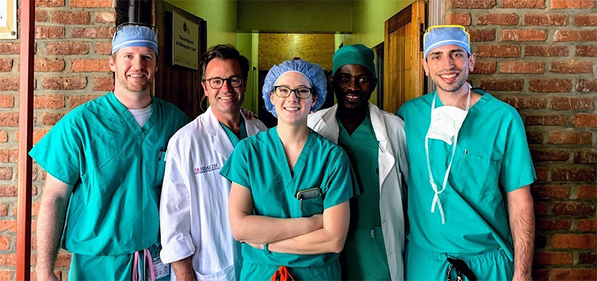 Surgery resident Chelsea Olson, M.D., center, traveled with a group from USA Health and the Whiddon College of Medicine on a mission trip to Rwanda prior to the COVID pandemic. Olson was elected House Staff chair for 2022-23.Download larger image
