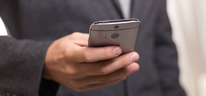 A healthcare provider using a smartphone