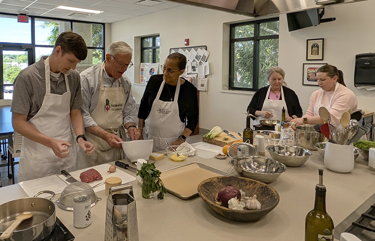 Whiddon College of Medicine Business Office staff participate in cooking class
