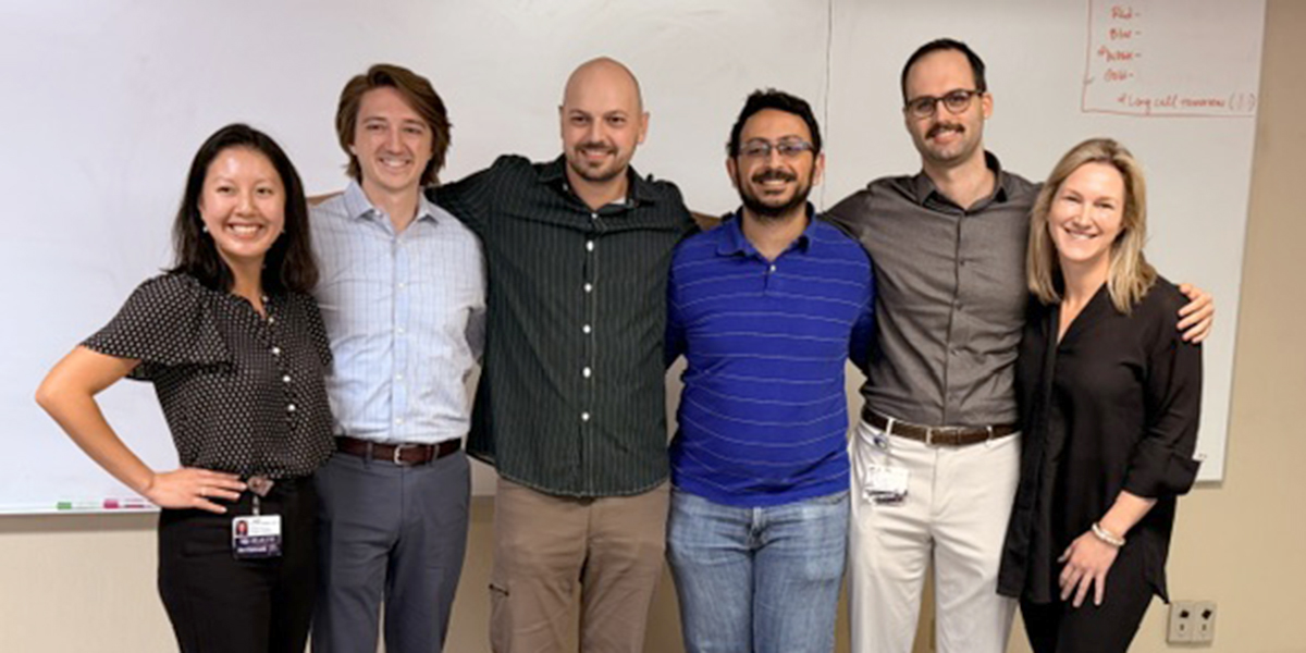 Emergency medicine resident physicians take part in an academic research day