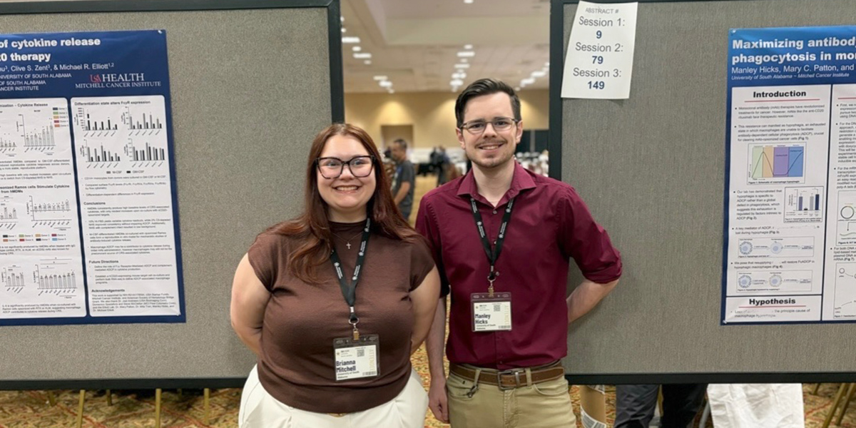 Brianna Mitchell and Manley Hicks, both doctoral students in the Basic Medical Sciences Graduate Program, presented research focused on improving the effectiveness and safety of monoclonal antibody therapies for cancer patients at the 2026 Southeastern Immunology Symposium.