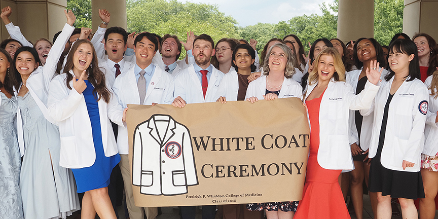 Class of 2028 cloaked with white coats, Gold Humanism Honor Society inducts new members
