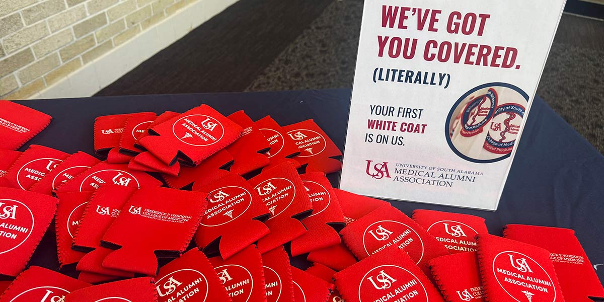 For many years, the USA Medical Alumni Association has marked an important milestone for medical students by providing white coats for rising third-year classes. This year, the association is proud to expand its support by sponsoring lab coats for Ph.D. candidates.