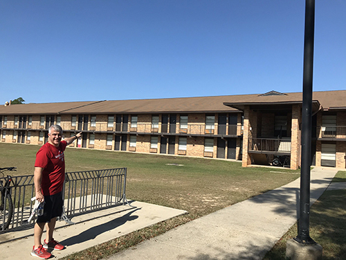Katrina's dad pointing to the dorms he lived in on campus.
