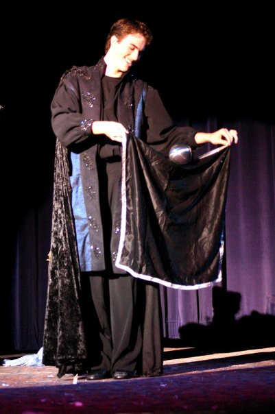 Morrison performing magic tricks