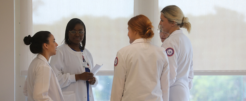 Nursing in a discussion in hospital. data-lightbox='featured'