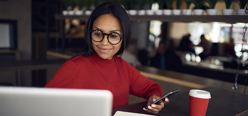 Woman in front of laptop applying to RN to BSN. data-lightbox='featured'