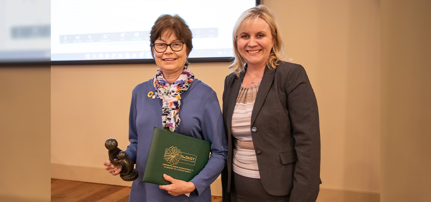 Dr. Brenda Woodmansee with Dr. Heather Hall receiving the DAISY award.