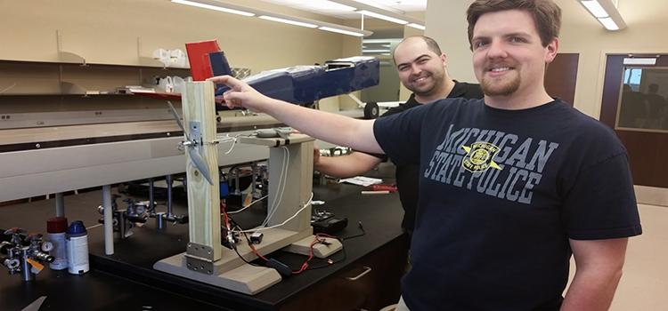 From front to back: Matt LaBoe and Fariboyz Bayat testing the propellor test stand data-lightbox='featured'