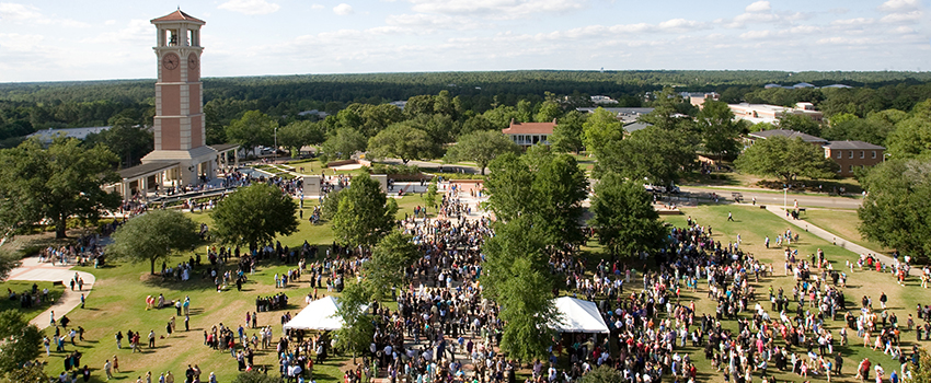 Alumni Plaza with people on campus