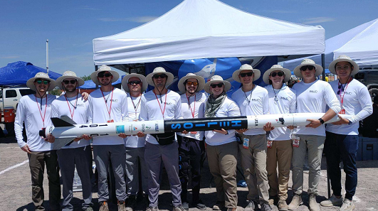 Pictured is the rocket Helios held by the Launch Society team:
Coleman Davis: Project Lead
Sam Jesse: Safety/Testing Lead
Ethan Ott: Structures/Propulsion Lead
Matthew Laski: Recovery Lead
Zach Miller: Payload Lead
Zane Box: Payload Team
Nathan Pierce: Structures Team
Josiah Pimperl: Recovery Team
Alex Jin: Outreach Lead
Matthew Van Welzen: Payload Team 