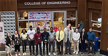 ECE Department Hosts Edge AI Summer Program attendees and faculty take a group picture in the Shelby Hall atrium.