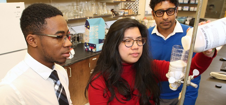 University of South Alabama engineering students Bryant Baldwin, left, and Rachel Chai, center, are creating a filter to adsorb, or adhere, phosphate from wastewater and/or stormwater, under the guidance of Dr. Arka Pandit, an assistant professor of civil, coastal and environmental engineering at USA.