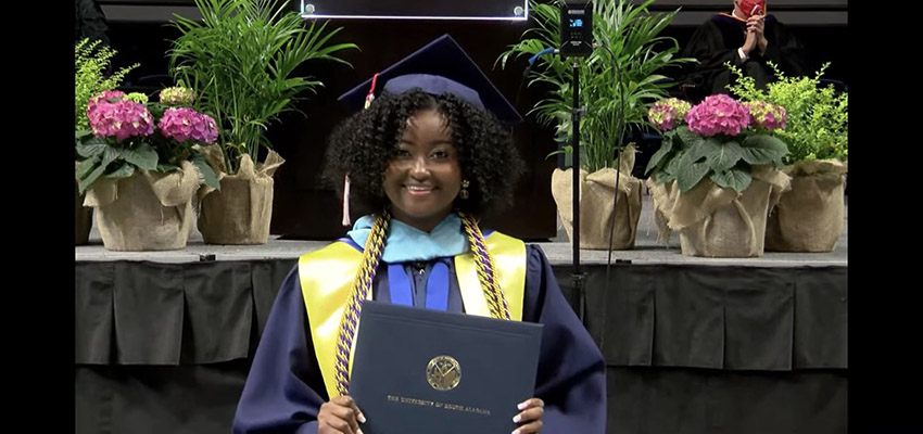 Student in cap and gown.