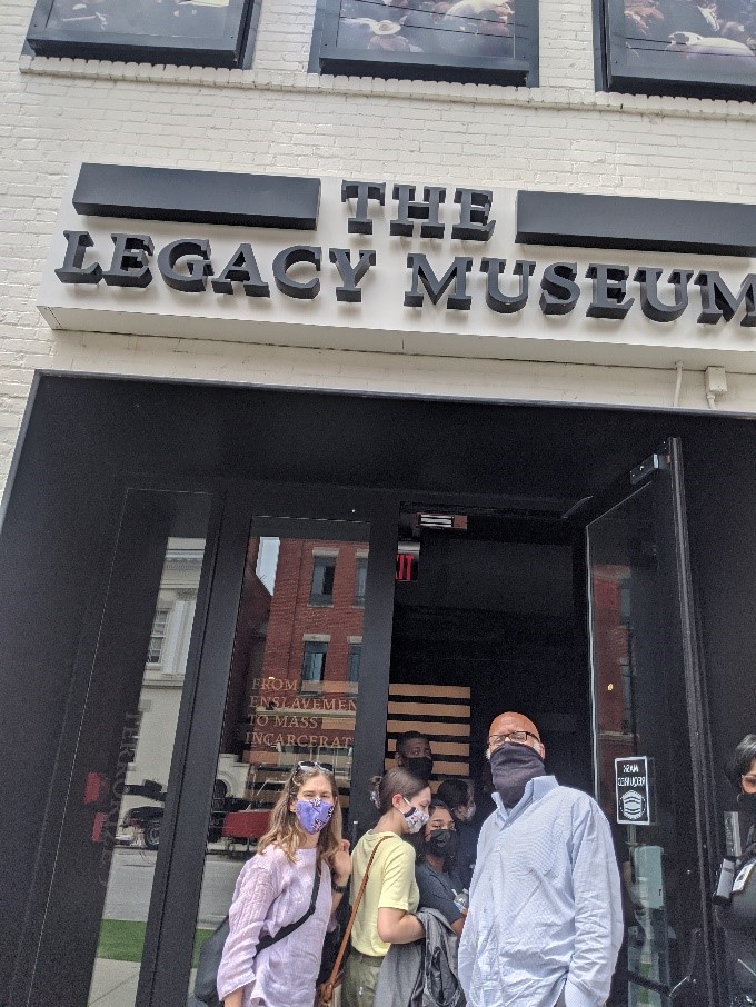 Students and Faculty standing outside the front of the Legacy Museum.