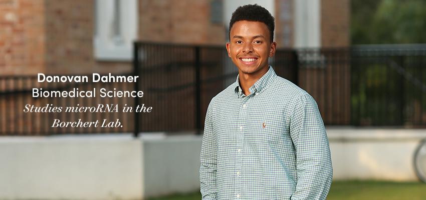 Donovan Dahmer standing outside of Honors College