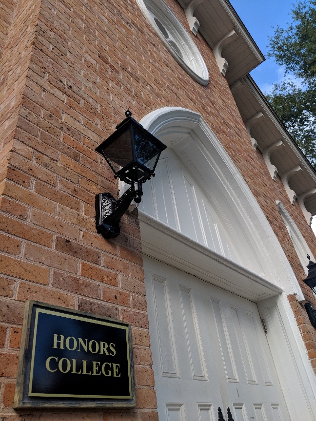 Front door and sign to Honors College