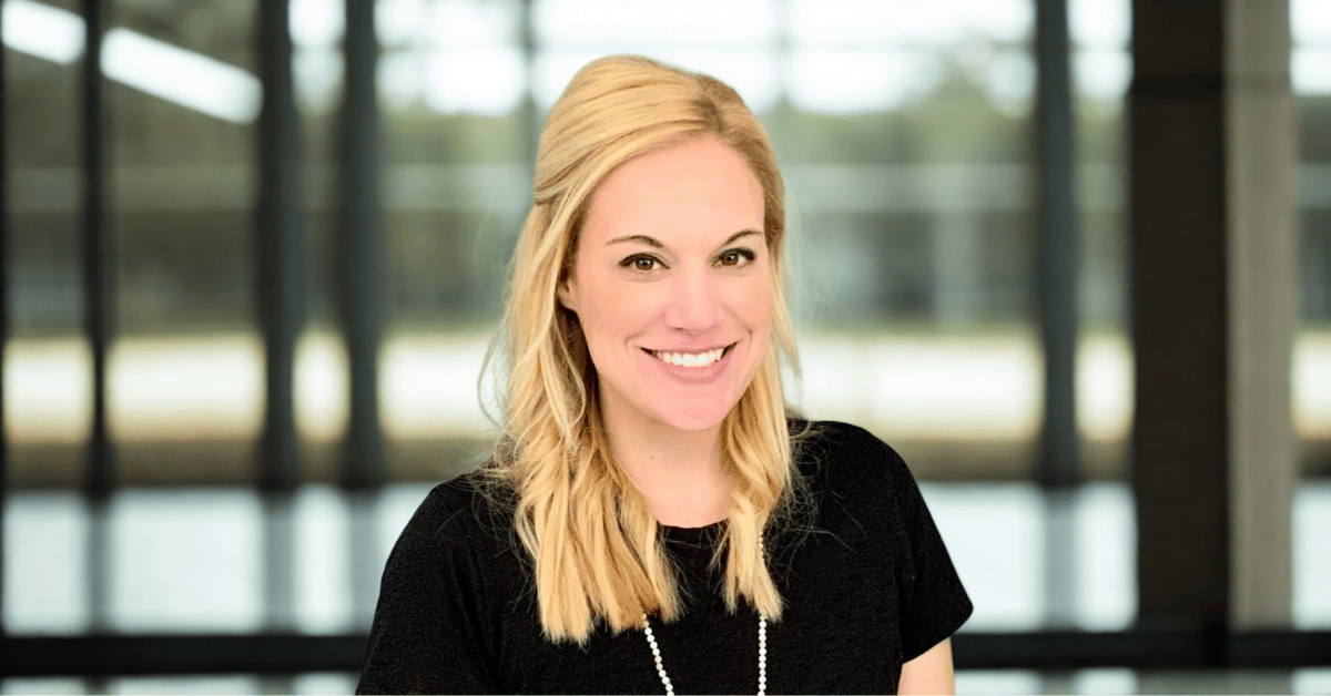 headshot of woman, Dr. Melanie Boudreaux, with long blonde hair and black shirt. 