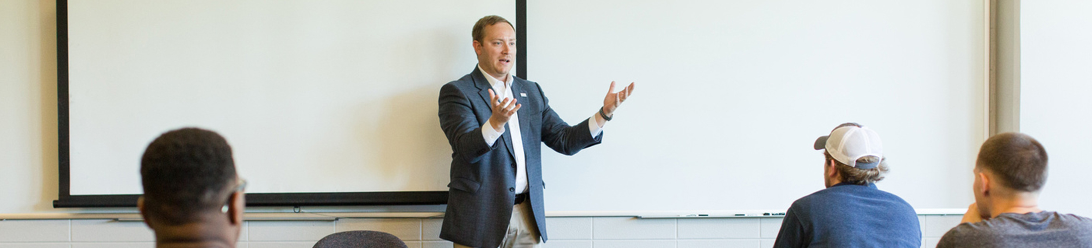 Professor teaching in front of class