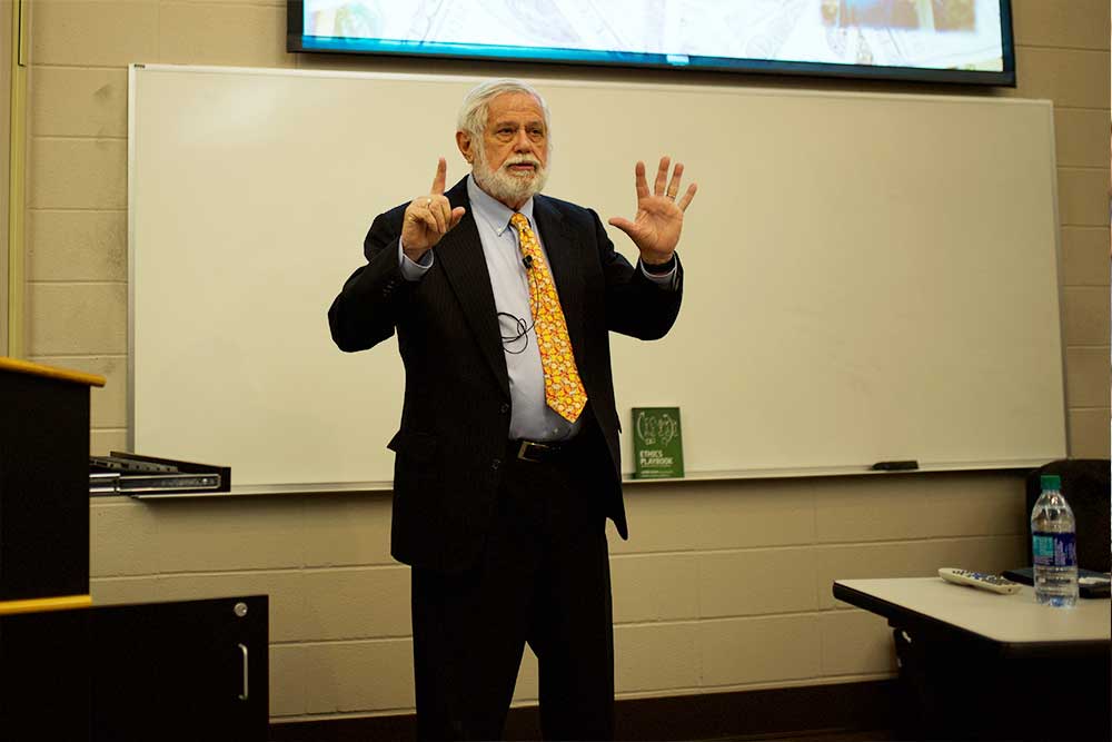 Aaron Beam presenting to a group of students.