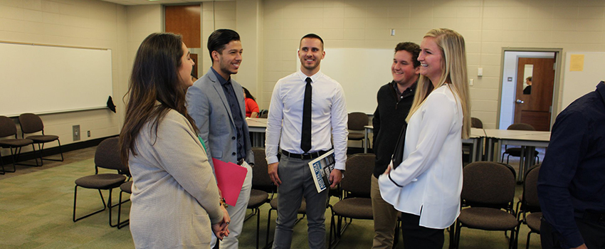 Students meeting with reps at Austal USA Career Day