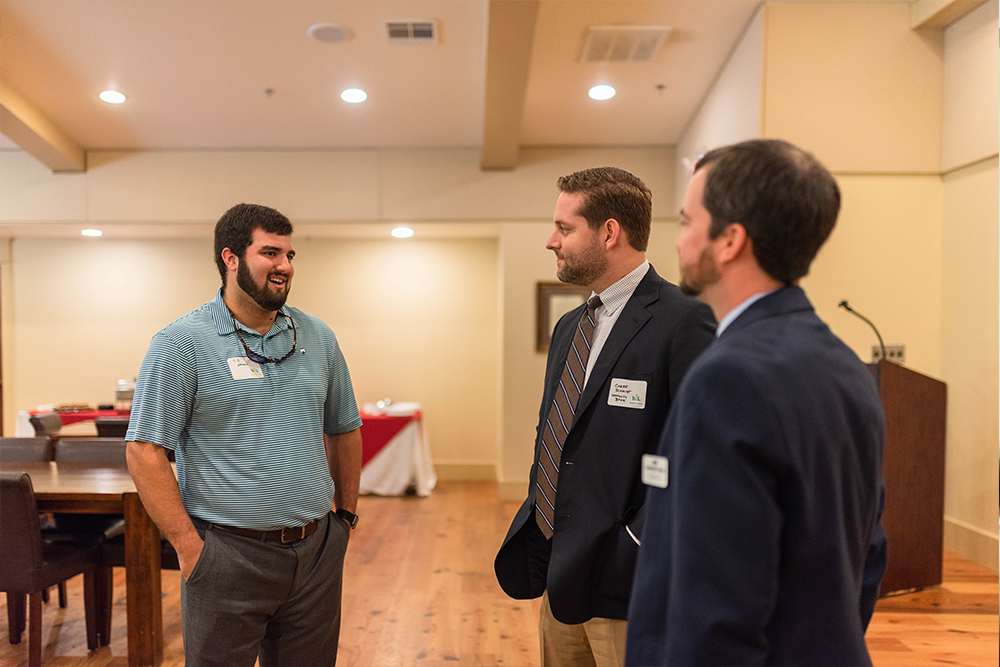 Student speaks to bank representatives.