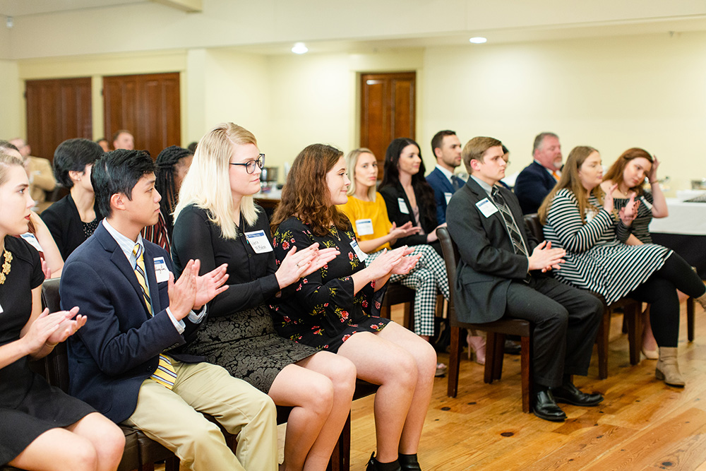Students clapping at Beta Gamma Sigma Ceremony
