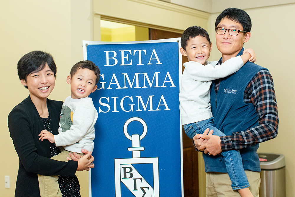 A grad student and her family at the Beta Gamma Sigma Ceremony